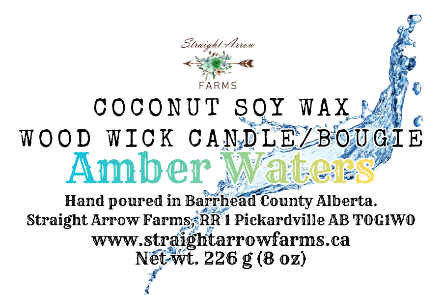 Label for Straight Arrow Farms coconut soy wax wood wick candle 'Amber Waters' with water design elements.