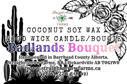 Advertisement for a coconut soy wax wood wick candle with cactus and rose design, badlands bouquet scent.